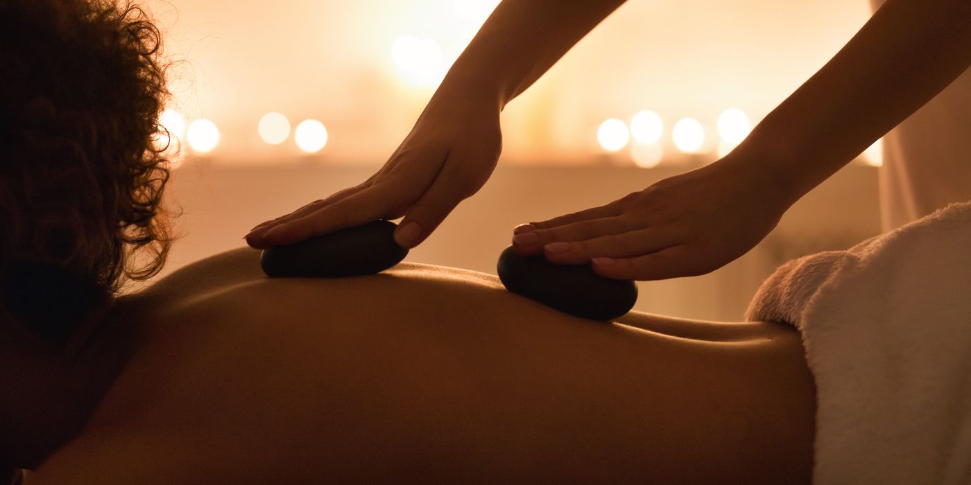 Hot stone massage by candlelight